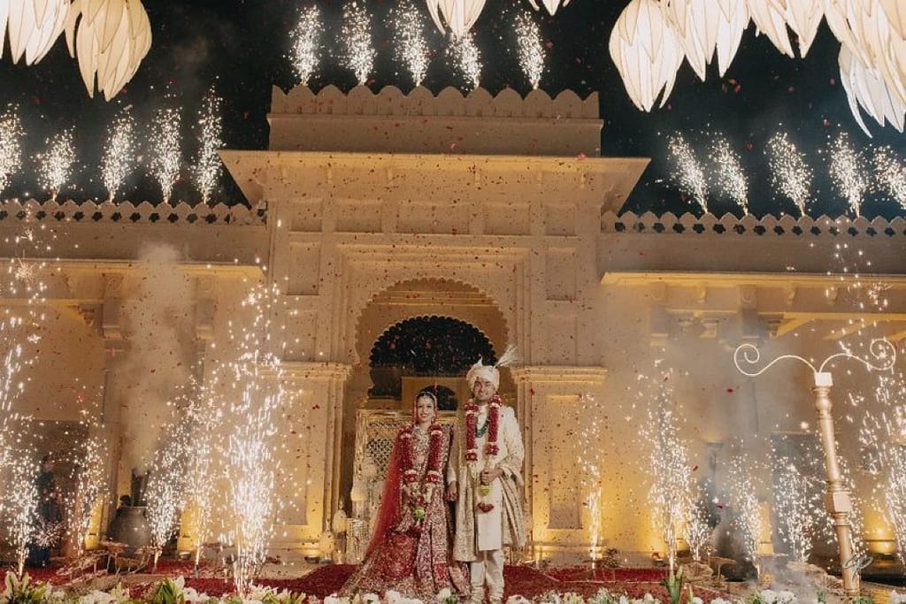 Theme weddings: Regal decor with grand drapery, rich fabrics, intricate patterns, and jewel tones like gold and red Image courtesy: Plush Weddings