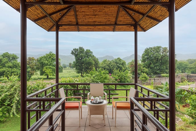 Aamaghati Wildlife Resort - A terrace that brings the outdoors with your morning tea